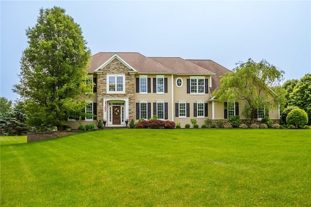 6305 Candlelight Run, Victor, NY 14564 - colonial house with a front yard and stone siding