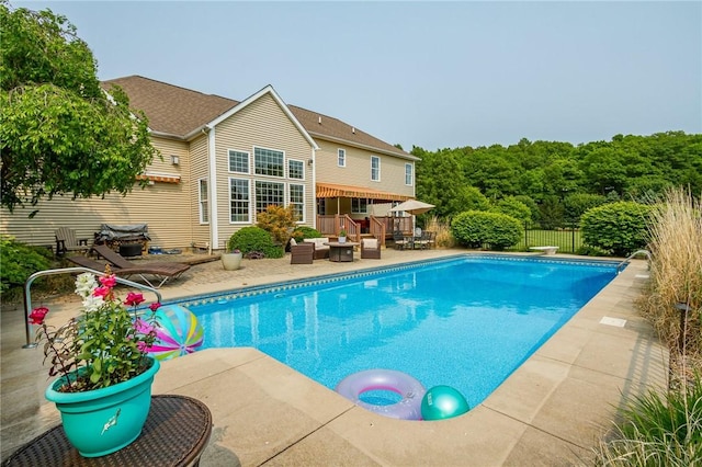 6305 Candlelight Run, Victor, NY 14564 - view of swimming pool featuring a patio, an outdoor hangout area, and a wooden deck