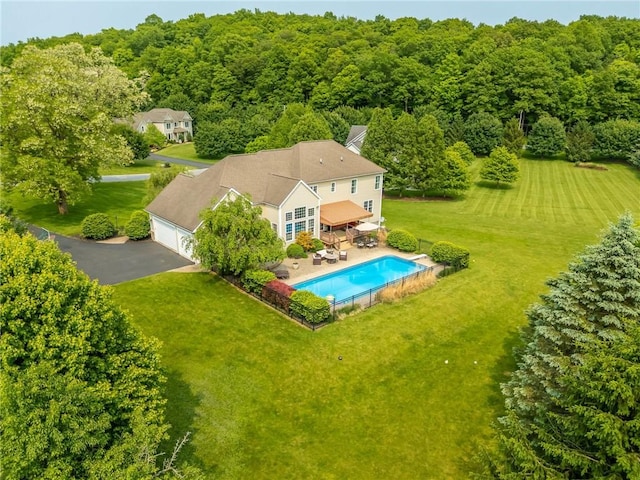 6305 Candlelight Run, Victor, NY 14564 - view from above of property with a pool area and a heavily wooded area