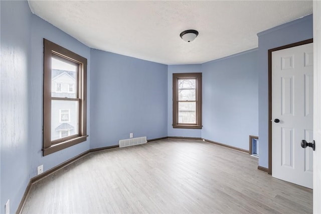 286 Kenwood Ave, Rochester, NY 14611 - spare room featuring wood finished floors and baseboards