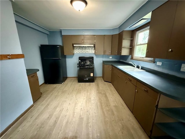 286 Kenwood Ave, Rochester, NY 14611 - kitchen with black appliances, open shelves, a sink, light wood finished floors, and dark countertops