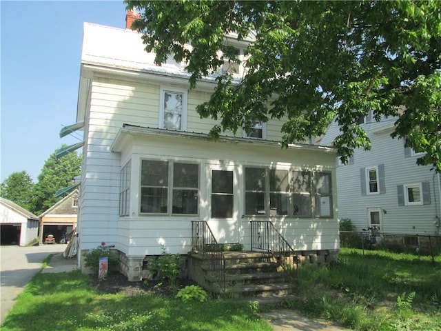 95 Wadsworth Ave, Avon, NY 14414 - traditional style home with an outbuilding, a chimney, and a front lawn