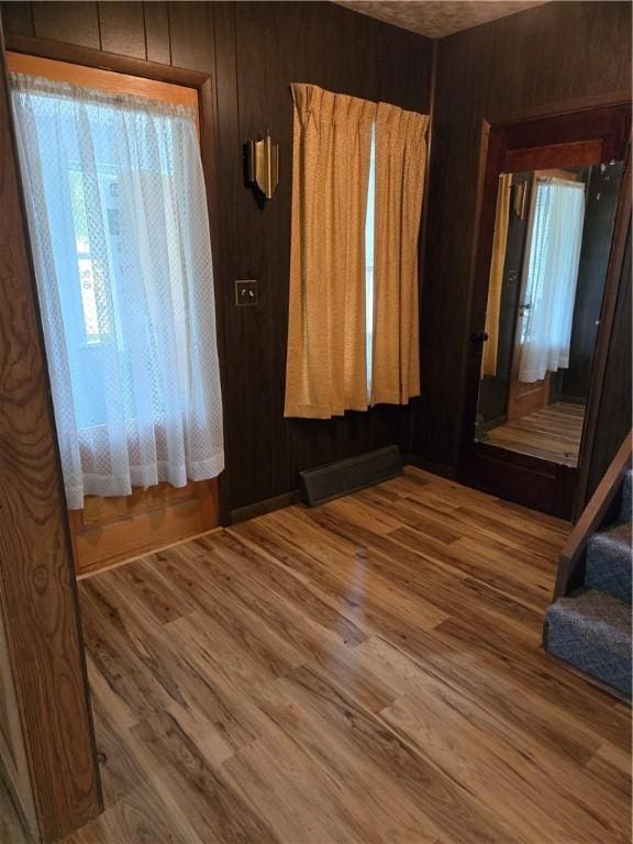 95 Wadsworth Ave, Avon, NY 14414 - unfurnished room featuring wooden walls and wood finished floors
