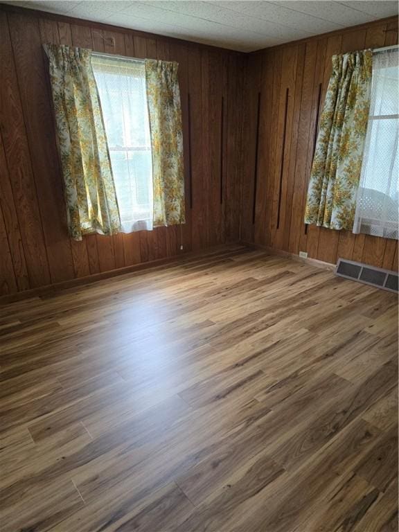 95 Wadsworth Ave, Avon, NY 14414 - empty room featuring wood finished floors and wooden walls