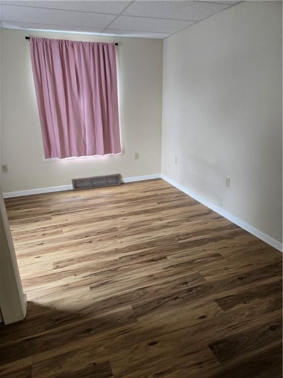 95 Wadsworth Ave, Avon, NY 14414 - spare room featuring wood finished floors and a drop ceiling