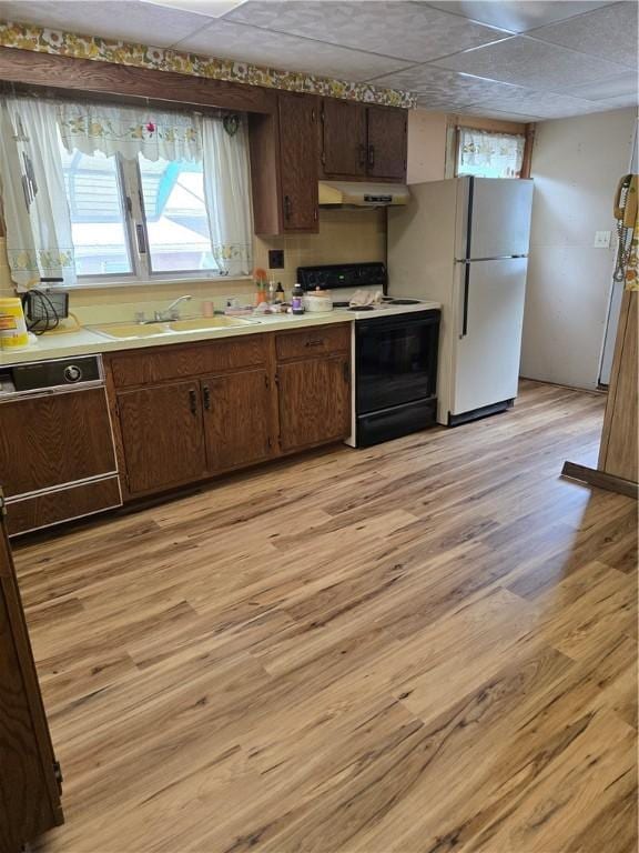 95 Wadsworth Ave, Avon, NY 14414 - kitchen with range with electric stovetop, under cabinet range hood, dishwasher, light wood-type flooring, and light countertops