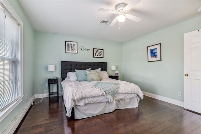 102 Trolley Line Rd, Hartwick, NY 13326 - bedroom with a baseboard radiator, dark wood-type flooring, baseboards, and a ceiling fan
