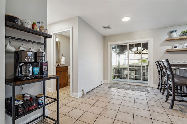 102 Trolley Line Rd, Hartwick, NY 13326 - dining area with a baseboard heating unit, light tile patterned floors, and baseboards