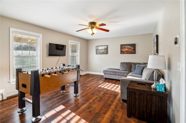 102 Trolley Line Rd, Hartwick, NY 13326 - playroom featuring ceiling fan, dark wood finished floors, and baseboards