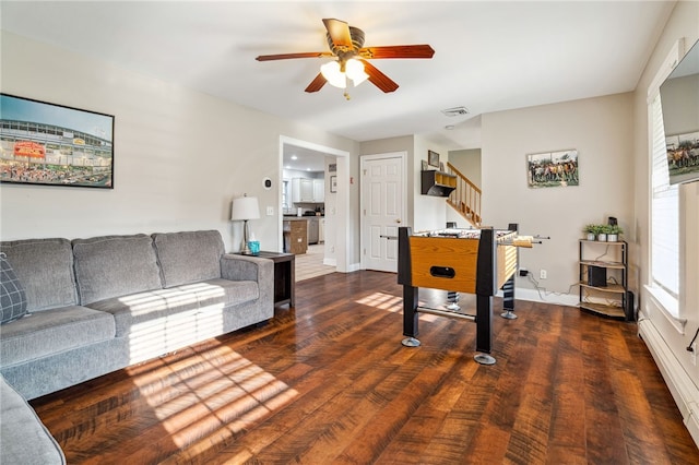 102 Trolley Line Rd, Hartwick, NY 13326 - recreation room featuring ceiling fan, wood finished floors, baseboard heating, and baseboards