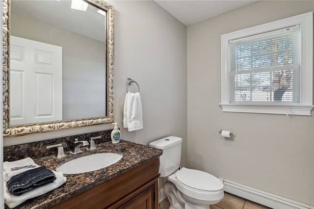 102 Trolley Line Rd, Hartwick, NY 13326 - half bathroom with a baseboard radiator, vanity, toilet, and tile patterned floors