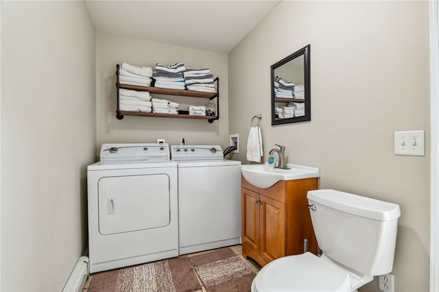 102 Trolley Line Rd, Hartwick, NY 13326 - washroom featuring washing machine and clothes dryer and baseboard heating