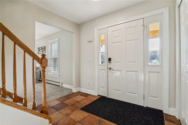 102 Trolley Line Rd, Hartwick, NY 13326 - foyer with stairway, baseboard heating, baseboards, and dark carpet