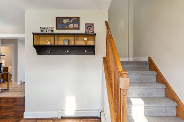 102 Trolley Line Rd, Hartwick, NY 13326 - stairs with a baseboard heating unit, tile patterned floors, and baseboards