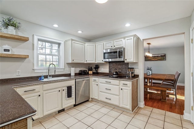 102 Trolley Line Rd, Hartwick, NY 13326 - kitchen with stainless steel appliances, a sink, dark countertops, white cabinetry, and recessed lighting