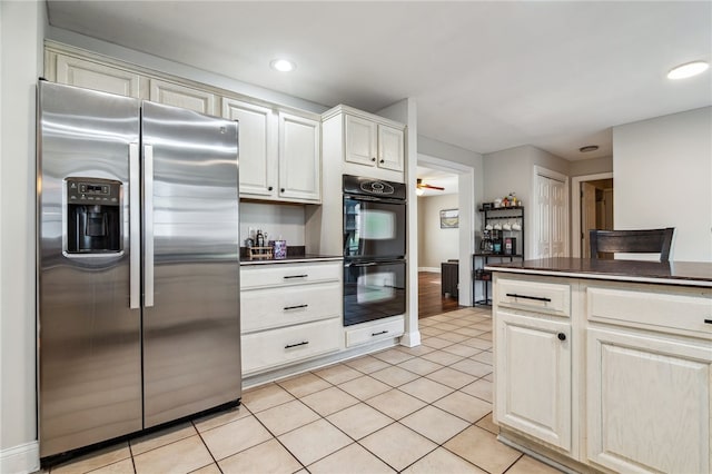 102 Trolley Line Rd, Hartwick, NY 13326 - kitchen with stainless steel fridge with ice dispenser, dark countertops, light tile patterned floors, recessed lighting, and baseboards