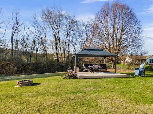 102 Trolley Line Rd, Hartwick, NY 13326 - view of grassy yard with an outdoor fire pit, a gazebo, and a wooden deck