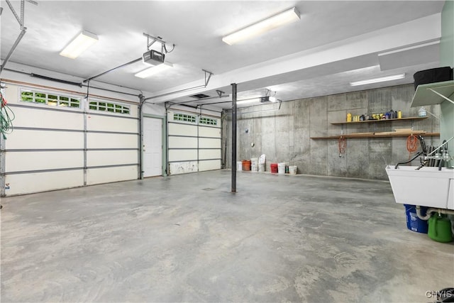 55 Redmond Rd, Trenton, NY 13304 - garage featuring a garage door opener and a sink