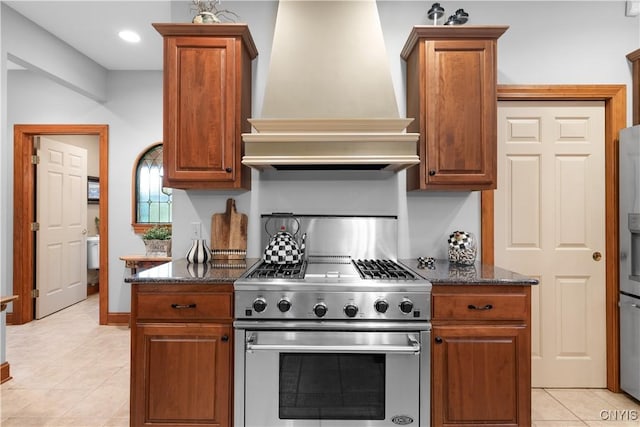 55 Redmond Rd, Trenton, NY 13304 - kitchen featuring stainless steel appliances, custom exhaust hood, light tile patterned flooring, brown cabinetry, and recessed lighting