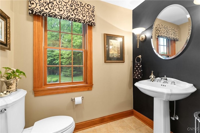 55 Redmond Rd, Trenton, NY 13304 - half bath with toilet, baseboards, and tile patterned floors