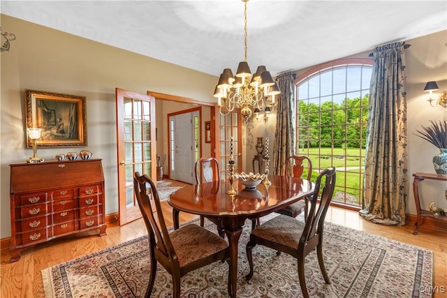 55 Redmond Rd, Trenton, NY 13304 - dining area with a chandelier, light wood-style flooring, and baseboards