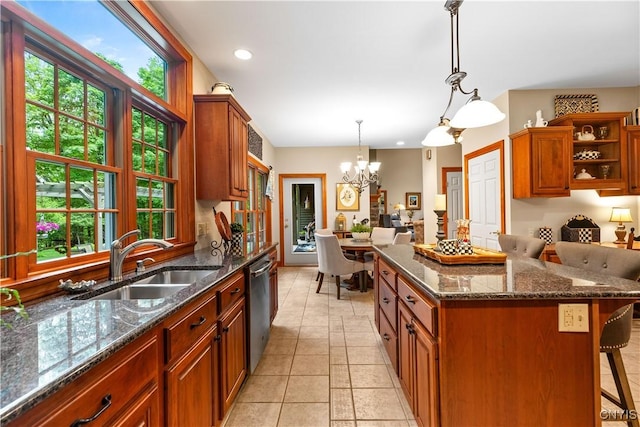 55 Redmond Rd, Trenton, NY 13304 - kitchen with a sink, a kitchen breakfast bar, stainless steel dishwasher, a chandelier, and a center island