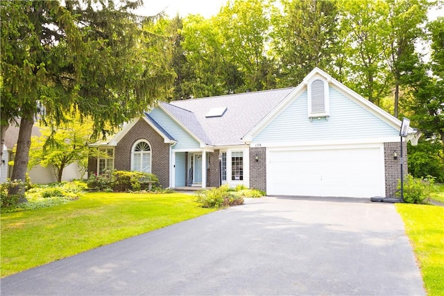 179 Kentucky Xing, Greece, NY 14612 - view of front of property featuring brick siding, driveway, a front yard, and an attached garage