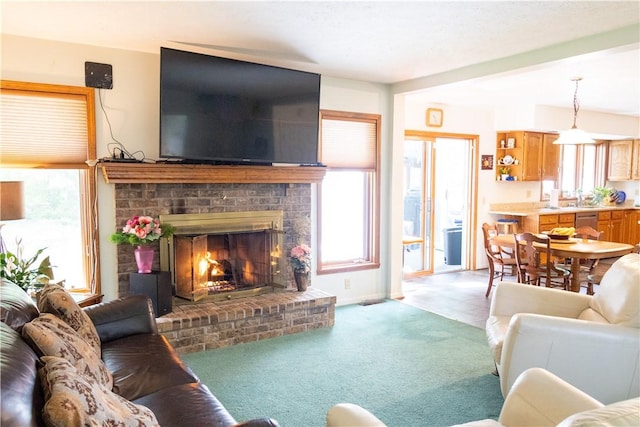 179 Kentucky Xing, Greece, NY 14612 - living room featuring plenty of natural light, light colored carpet, and a fireplace