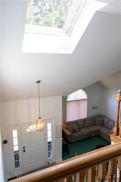 179 Kentucky Xing, Greece, NY 14612 - living room featuring a skylight and carpet