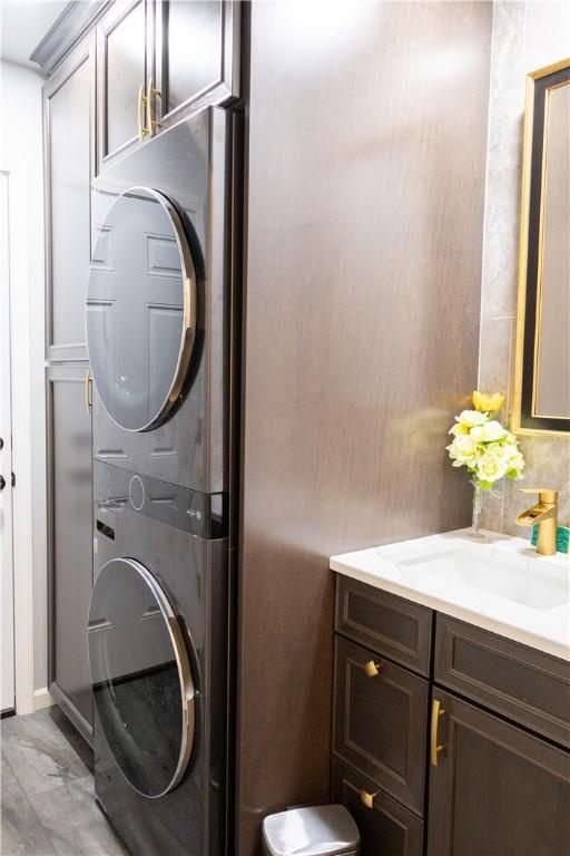179 Kentucky Xing, Greece, NY 14612 - laundry area featuring stacked washing machine and dryer