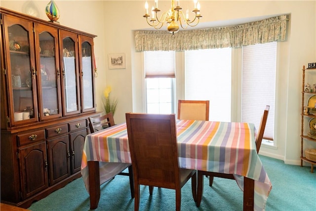 179 Kentucky Xing, Greece, NY 14612 - dining space featuring a chandelier, carpet floors, and baseboards