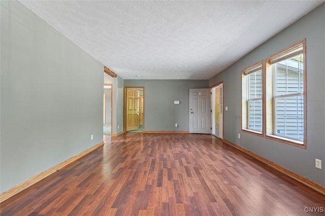 6669 Rottamore Rd, Stockbridge, NY 13409 - spare room with wood finished floors, a textured ceiling, and baseboards