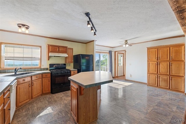 6669 Rottamore Rd, Stockbridge, NY 13409 - kitchen featuring black appliances, under cabinet range hood, a center island, a sink, and ornamental molding
