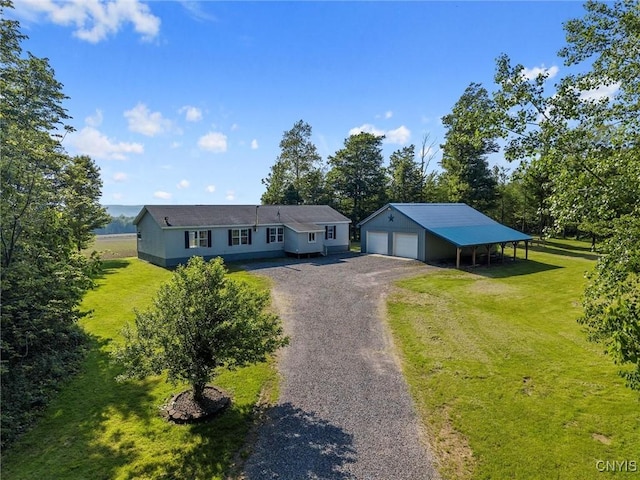 6669 Rottamore Rd, Stockbridge, NY 13409 - view of front of property with an outbuilding, a detached garage, a front yard, and asphalt driveway