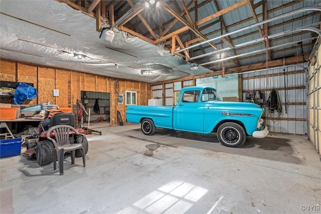 6669 Rottamore Rd, Stockbridge, NY 13409 - garage featuring a garage door opener
