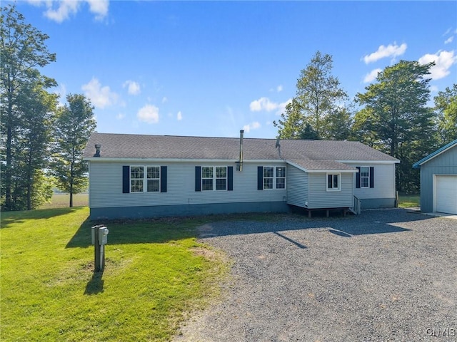 6669 Rottamore Rd, Stockbridge, NY 13409 - manufactured / mobile home with a front yard, gravel driveway, an outbuilding, and a garage
