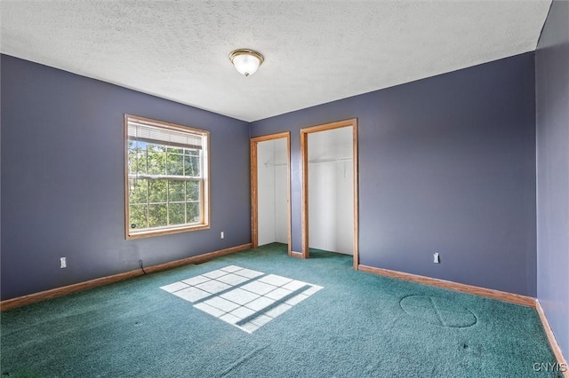 6669 Rottamore Rd, Stockbridge, NY 13409 - unfurnished bedroom with carpet flooring, baseboards, and a textured ceiling