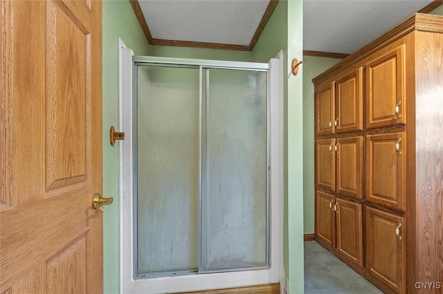 6669 Rottamore Rd, Stockbridge, NY 13409 - bathroom with ornamental molding, a shower stall, and tile patterned floors