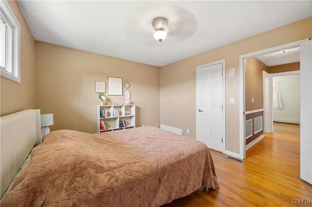 3477 Mcclary Rd, Lafayette, NY 13084 - bedroom featuring light wood-type flooring and baseboards