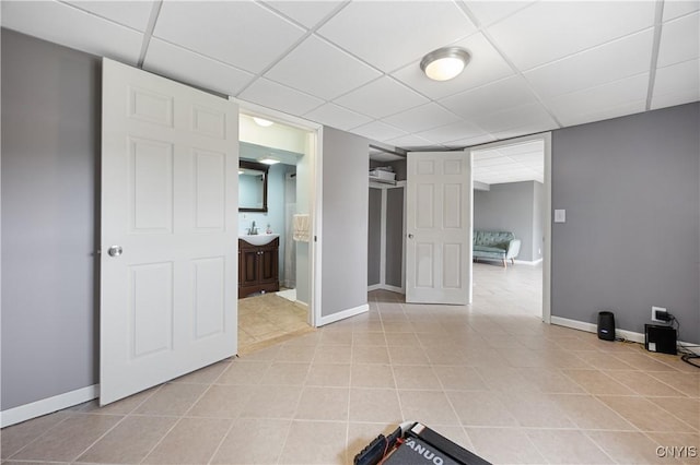 3477 Mcclary Rd, Lafayette, NY 13084 - spare room with a drop ceiling, baseboards, and light tile patterned floors