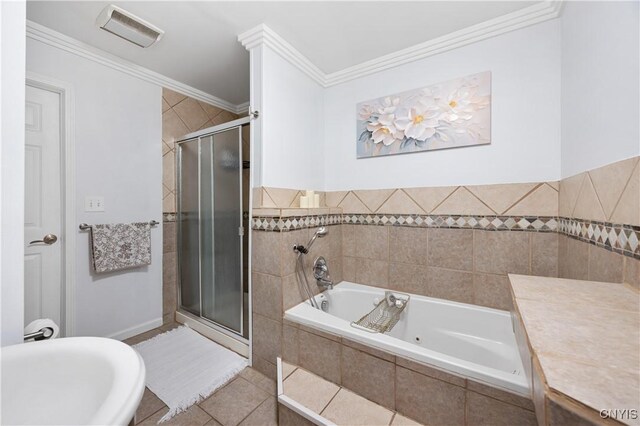 3477 Mcclary Rd, Lafayette, NY 13084 - bathroom featuring a whirlpool tub, a shower stall, crown molding, and tile patterned floors