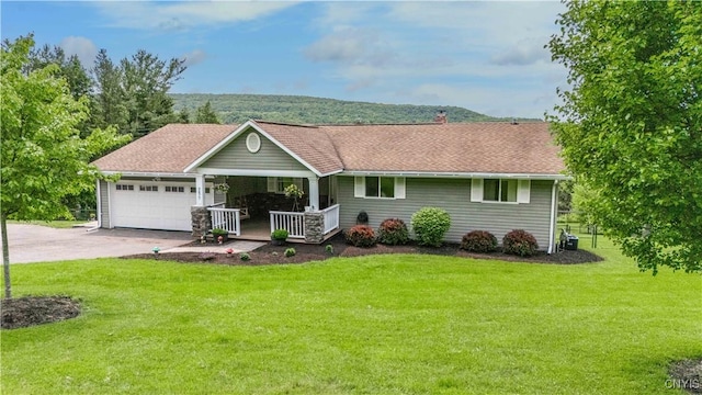3477 Mcclary Rd, Lafayette, NY 13084 - ranch-style home featuring covered porch, an attached garage, concrete driveway, and a front lawn