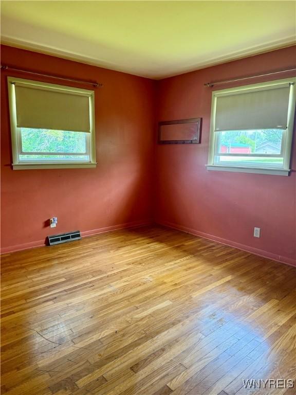 3394 Pike Rd, Alexander, NY 14020 - unfurnished room with wood-type flooring and baseboards