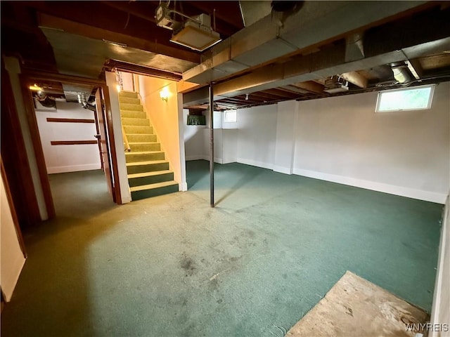 3394 Pike Rd, Alexander, NY 14020 - below grade area featuring stairway and baseboards