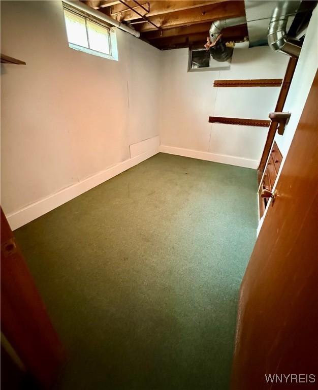 3394 Pike Rd, Alexander, NY 14020 - below grade area with baseboards and carpet flooring