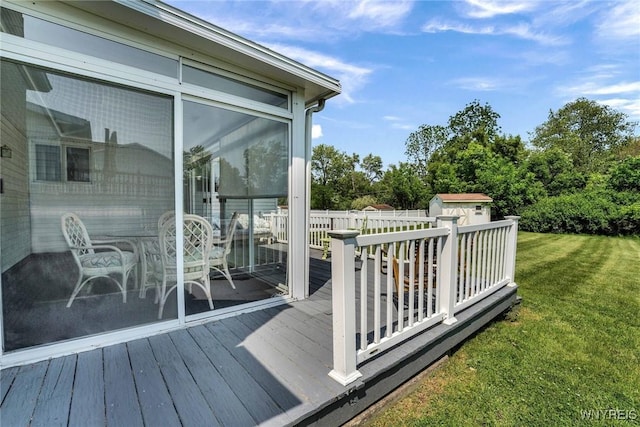 61 Caesar Blvd, Amherst, NY 14221 - deck featuring a yard and a sunroom