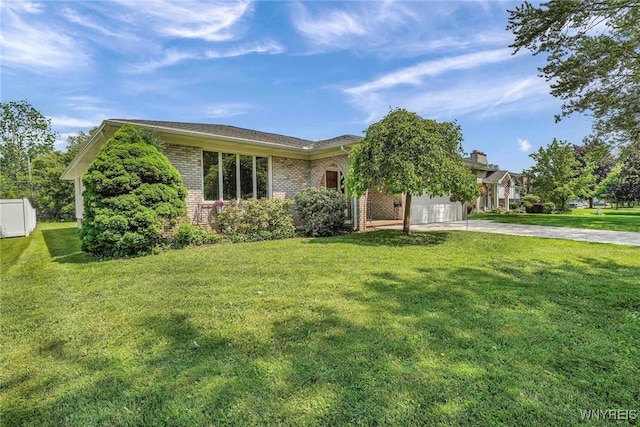 61 Caesar Blvd, Amherst, NY 14221 - view of front of house featuring concrete driveway, brick siding, a garage, and a front yard