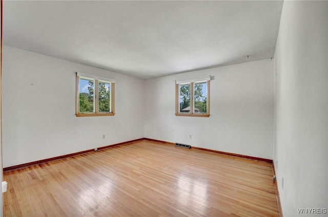 61 Caesar Blvd, Amherst, NY 14221 - spare room with healthy amount of natural light, wood finished floors, and baseboards