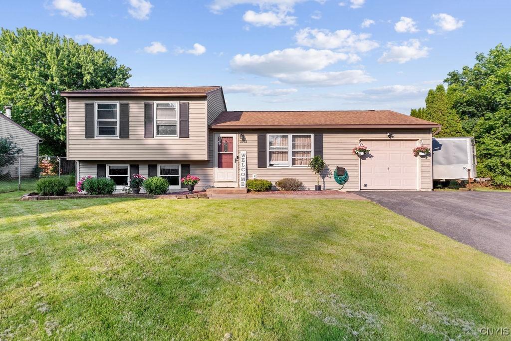 5931 Brigadier Dr, Cicero, NY 13039 - tri-level home with a garage and driveway