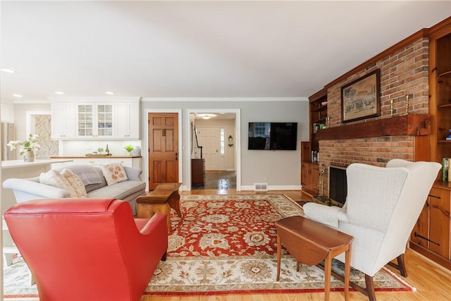 307 Allens Creek Rd, Brighton, NY 14618 - living area with baseboards, ornamental molding, recessed lighting, light wood finished floors, and a fireplace